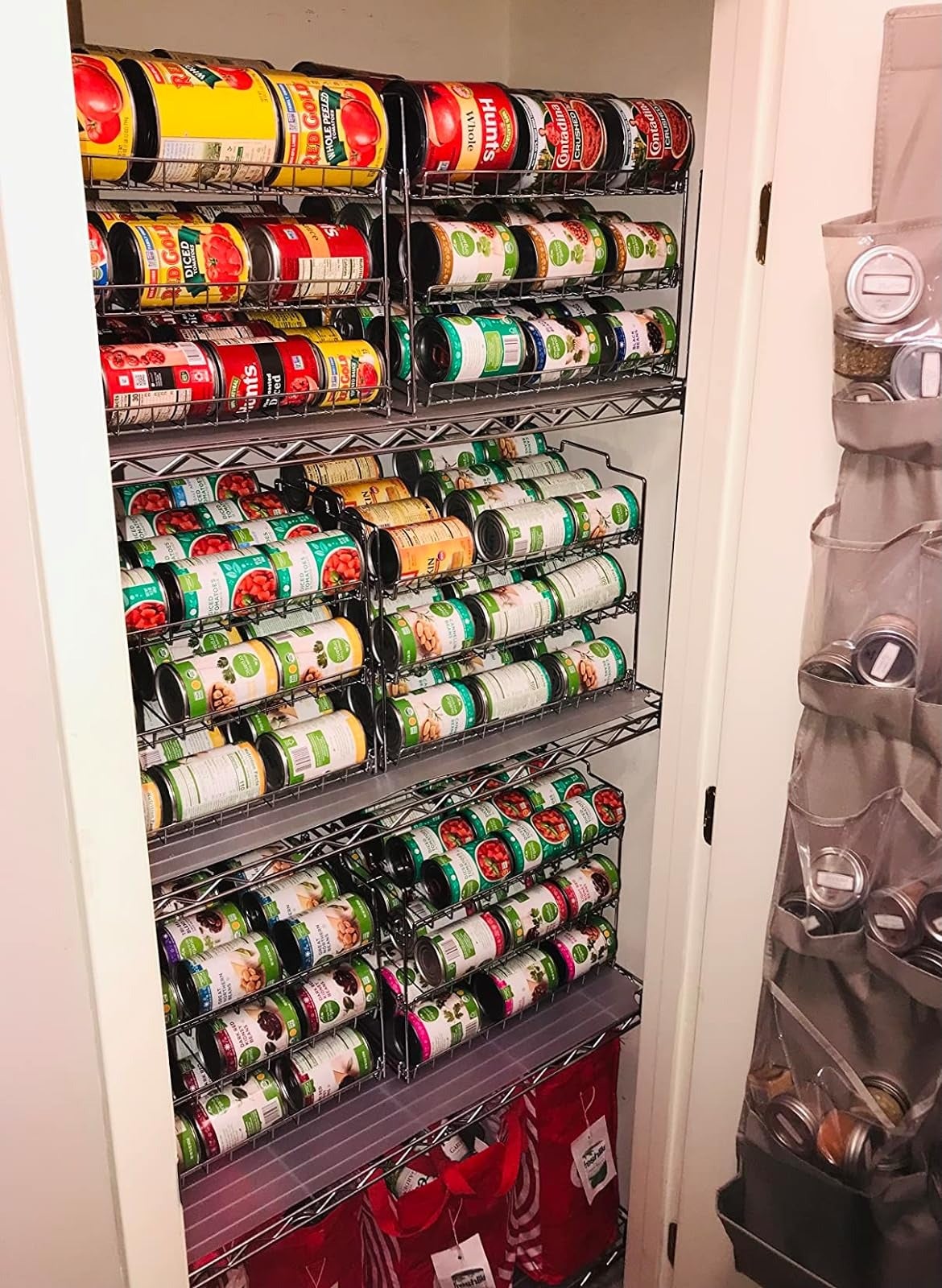 Organized pantry shelves with various canned goods on the rack
