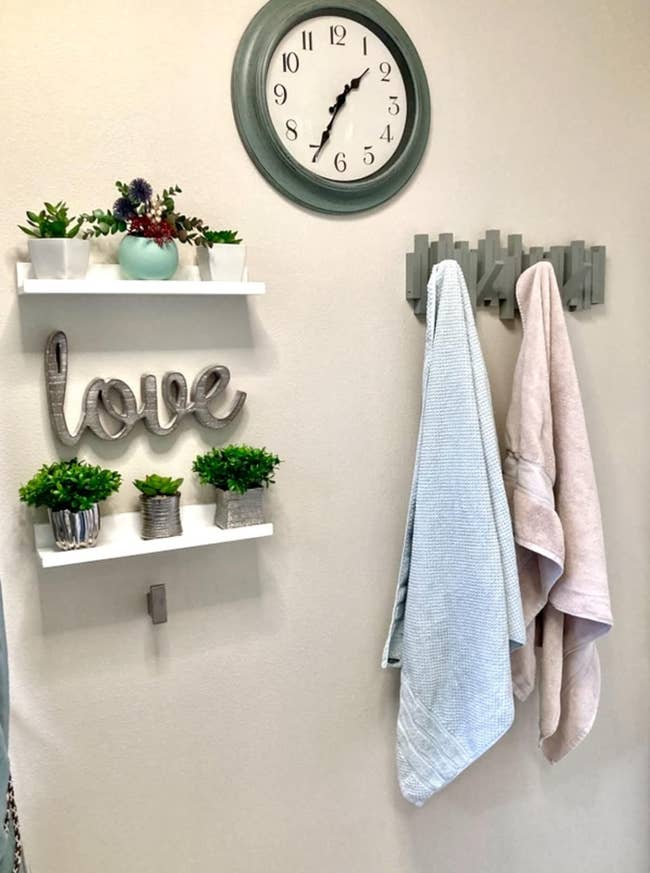 Wall-mounted shelf with decorative items, 