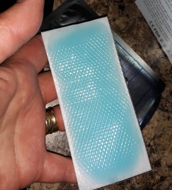 reviewer holding up a gel pad