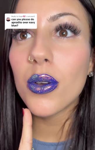 queen cosmetics creator showing the yellow aphrodite shade layered over a navy blue lipstick