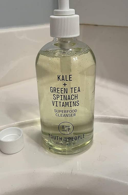 The bottle of cleanser on the sink counter
