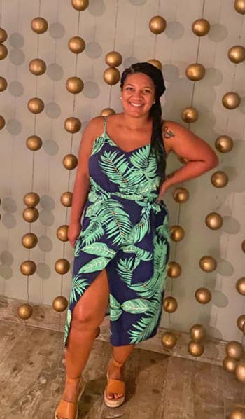 reviewer in tropical print dress