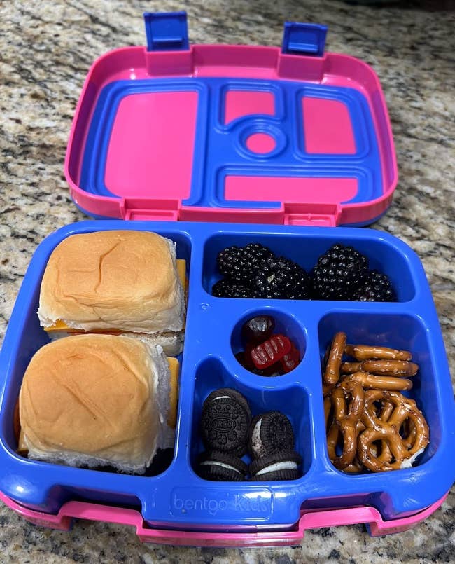 reviewer's child's lunchbox with food in each compartment