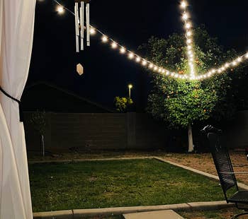 the glove lights strung up across a backyard