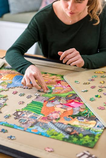 a model doing a puzzle inside of the puzzle board
