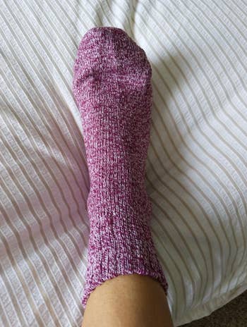 Reviewer wearing purple marled sock 