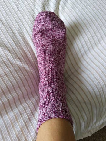 Reviewer wearing purple marled sock 