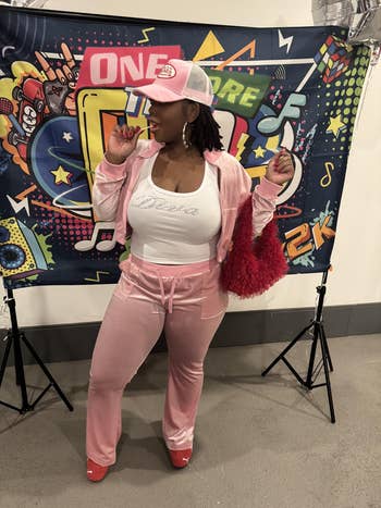 Person wearing casual, stylish pinkish  tracksuit and matching cap, holding a reddish  furry container  successful  beforehand   of a retro-themed backdrop