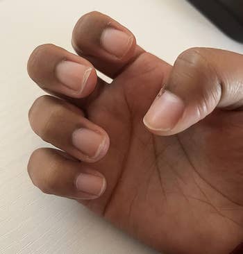 reviewer's nails before using the cuticle oil