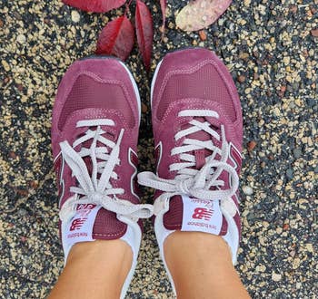 a reviewer wearing the shoes in burgundy 