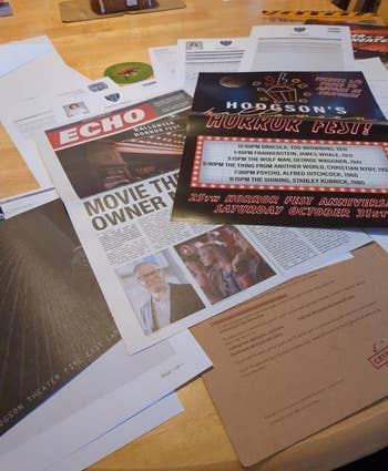 A array with assorted lawsuit flyers and newsletters