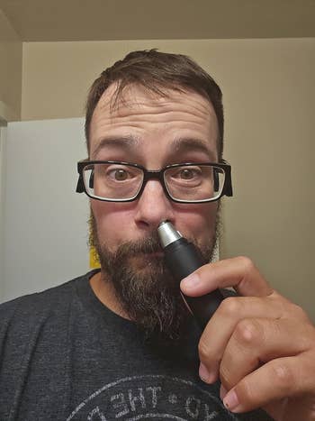a reviewer utilizing the trimmer successful  they're nose