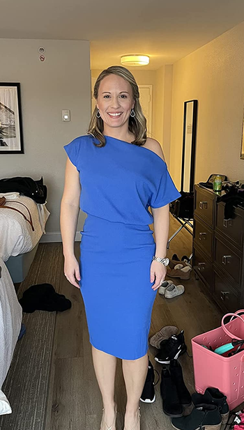 Reviewer wearing blue midi dress