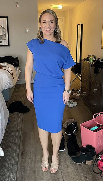 Reviewer wearing blue midi dress