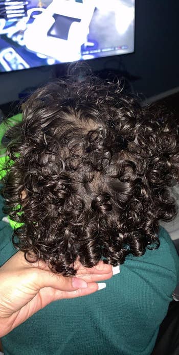 another reviewer's child with shiny, curly hair