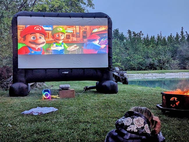 a reviewer's large inflatable screen in their backyard