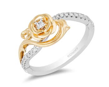 a front view of the ring that shows the gold flower design and center diamond 