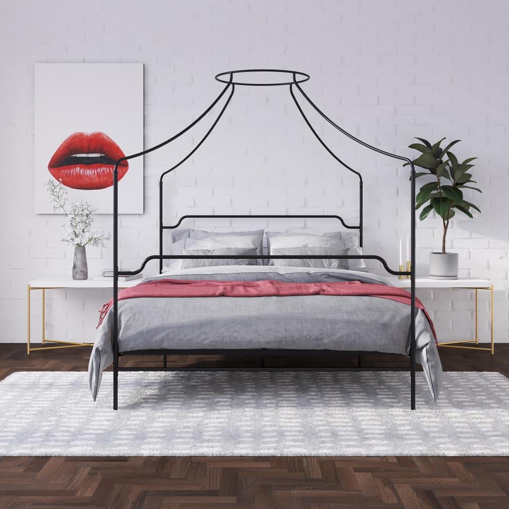 the black four-poster canopy bed