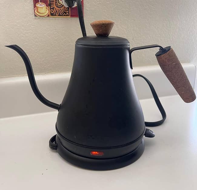 Sleek electrical kettle with a gooseneck spout and cork grip