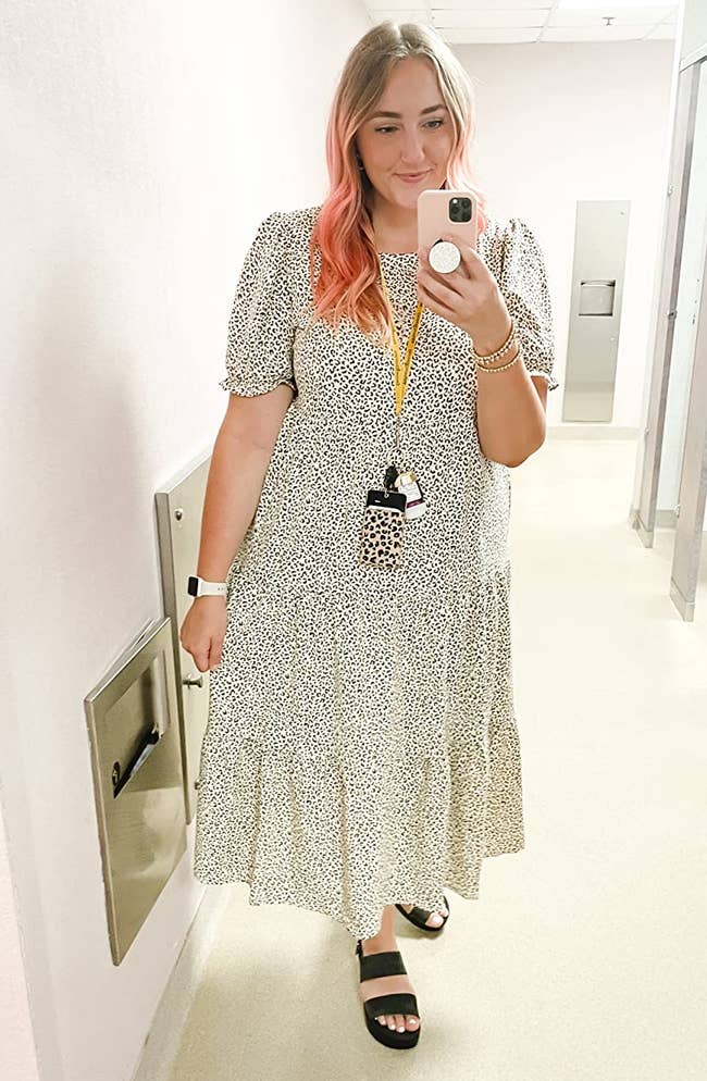 a reviewer wearing the dress in apricot  