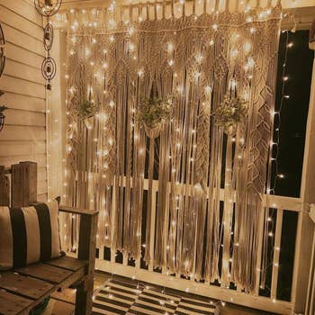 A reviewers porch with the white fairy lights strung on the wall