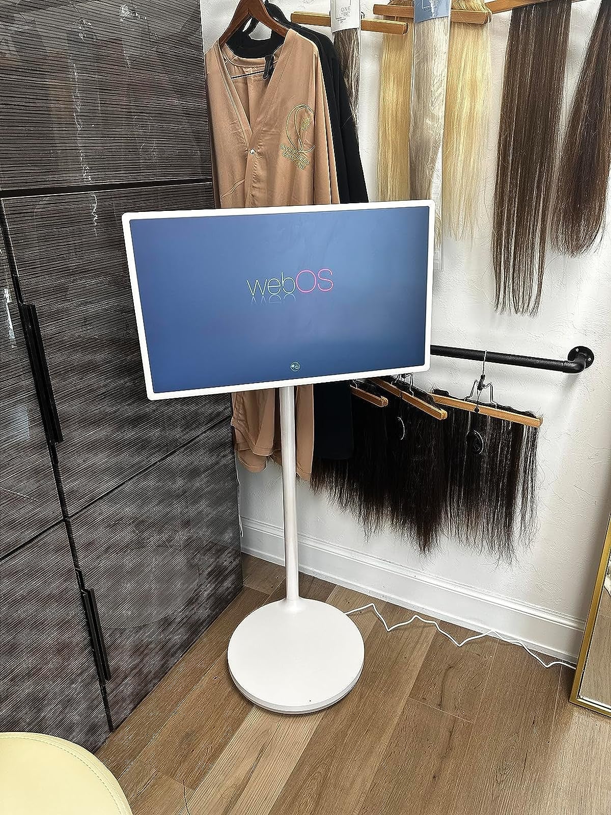 a reviewer's tablet on the stand in their room