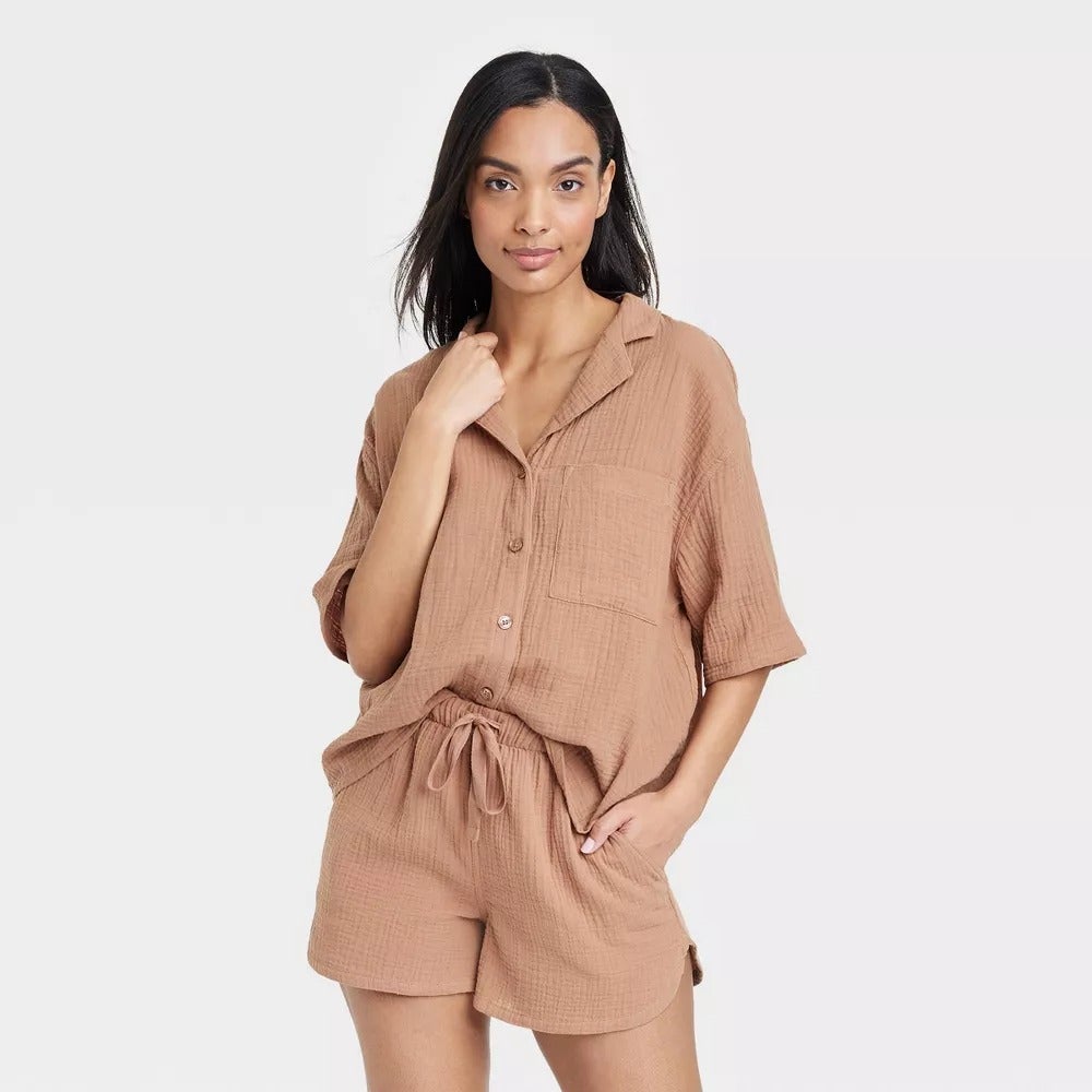 a model wearing the brown top