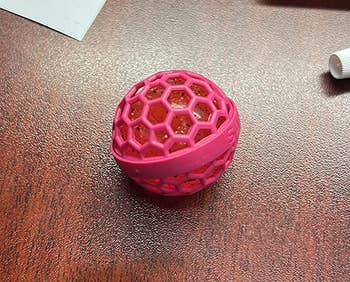 A reviewer's Clean Ball with its honeycomb outer part on