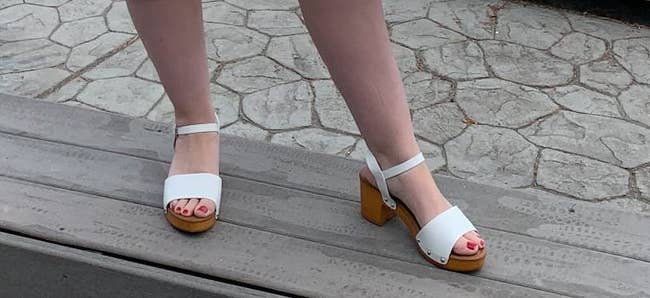 a reviewer wearing the shoes in white 