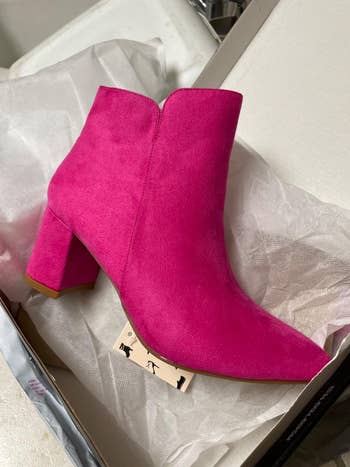 Pink suede ankle boots with a artifact bottommost connected achromatic insubstantial paper, acceptable successful a shoebox, suitable for trendy manner shopping
