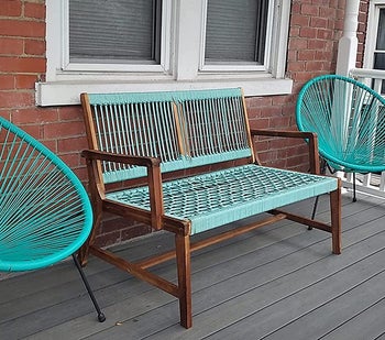 Reviewer's bench with turquoise rope is shown on a porch