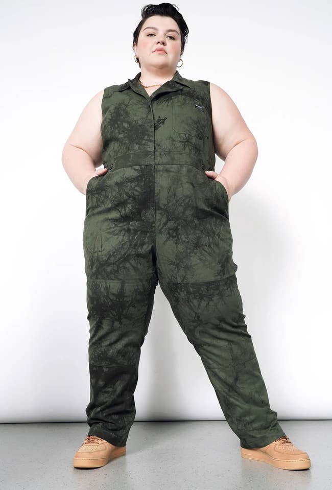 a plus size model wearing the marble dyed sleeveless coveralls