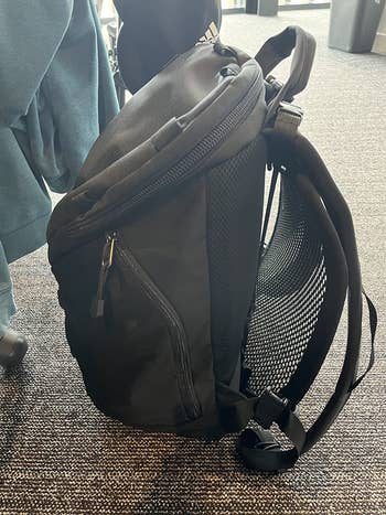 a backpack with the VentaPak clipped to the back of it