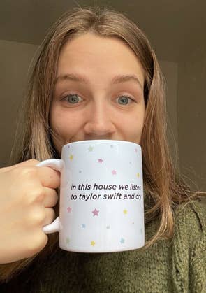buzzfeed writer holding the mug in front of her face