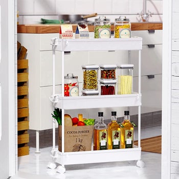 same cart in white being used in the kitchen