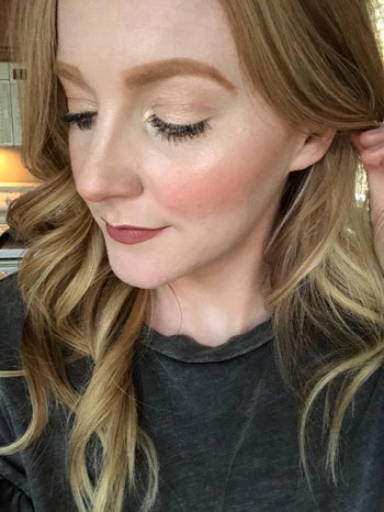 reviewer showing the bronzer used on their skin, giving a flushed look