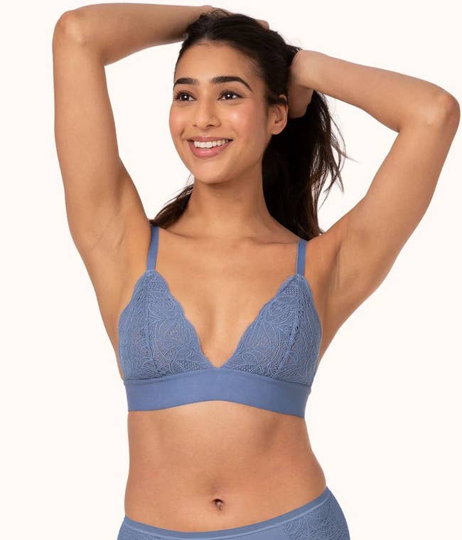 model wearing the lace bralette in blue