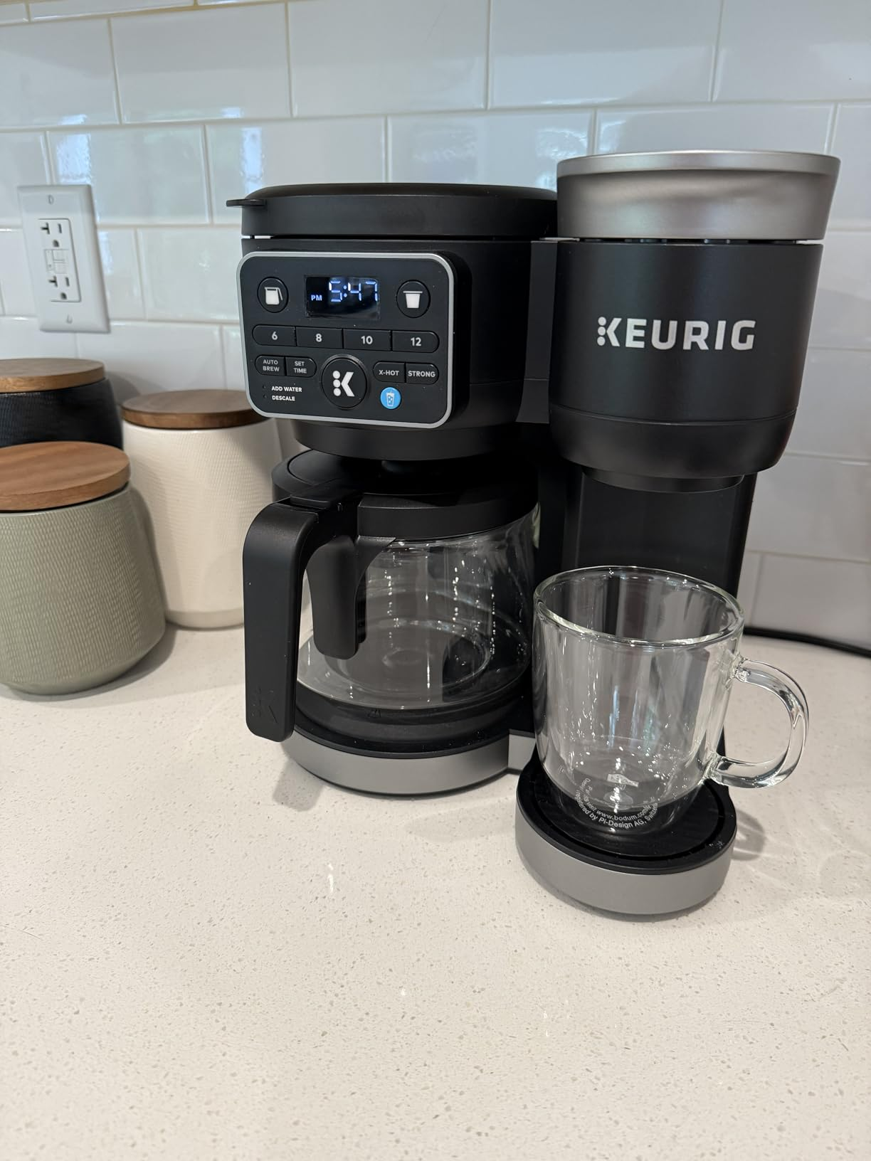 Keurig dual java  shaper  connected  a room  counter, featuring some  a solid  carafe and single-serve option, adjacent  to a wide   mug