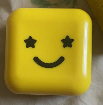The case with a smiling face featuring star-shaped eyes