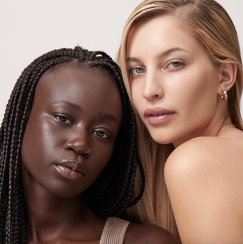 two models with different skin tones wearing the skin tint