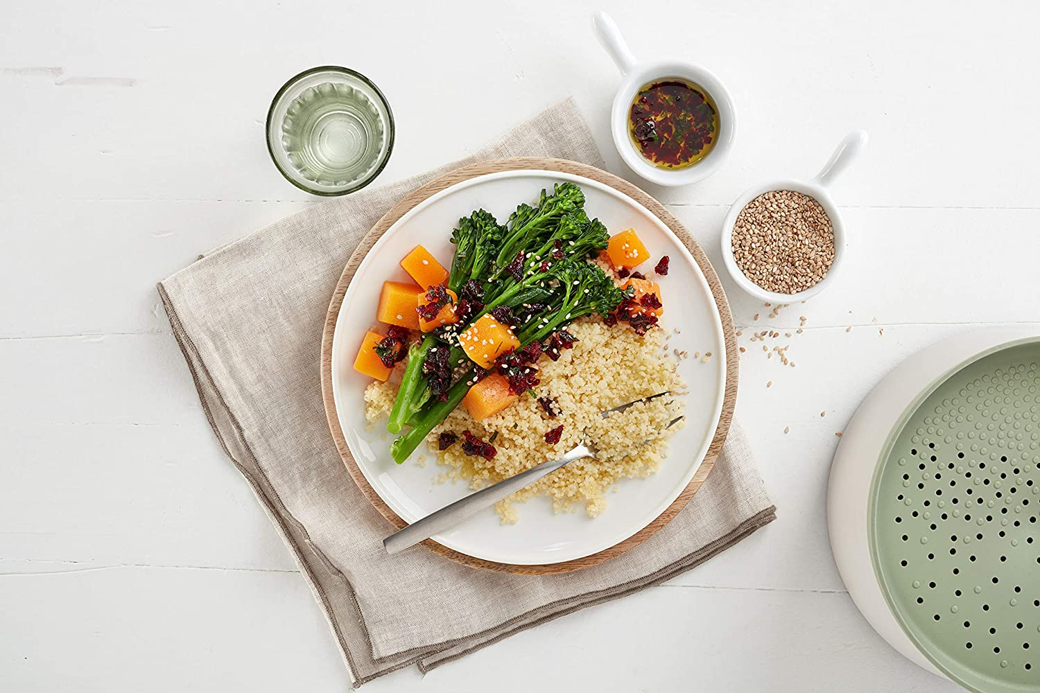 A meal with various grains next to the cooker