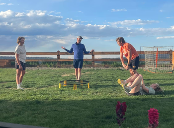 Reviewer photo of a group of four people playing the game outside