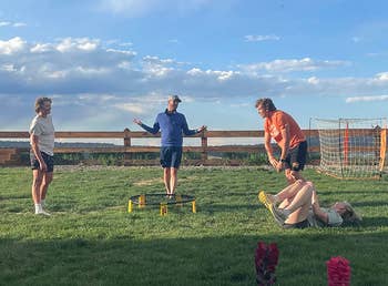 Reviewer photo of a group of four people playing the game outside