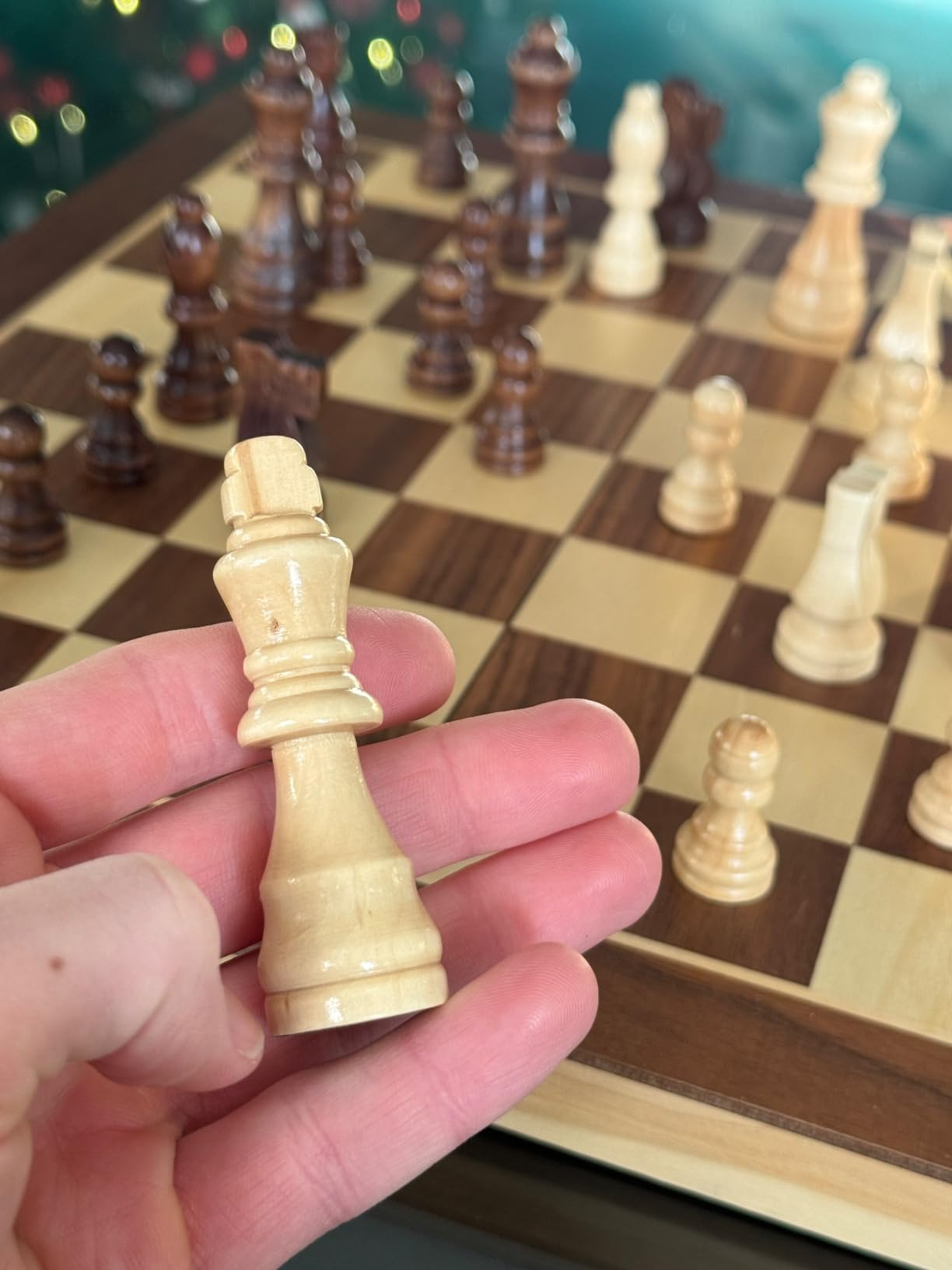 reviewer holding a chess portion   