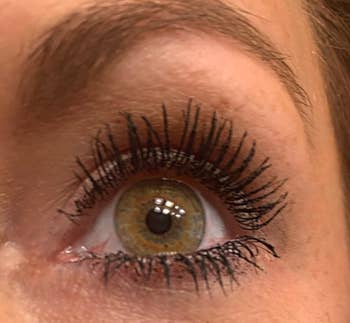 A close up of the reviewer's super long lashes after applying mascara
