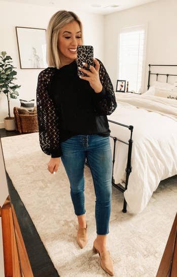 Reviewer wearing the top in black