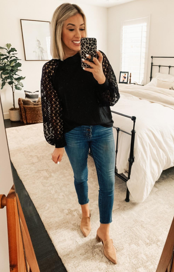Reviewer wearing the top in black