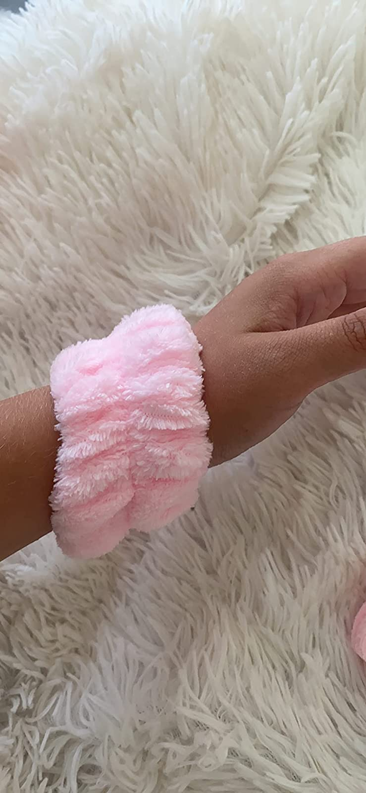 Reviewer wearing the towel cuff in light pink