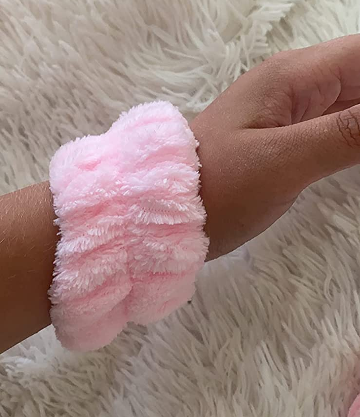 Reviewer wearing the towel cuff in light pink