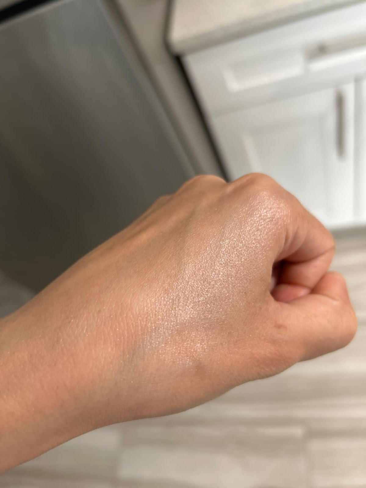 reviewer investigating  illuminator connected  hand